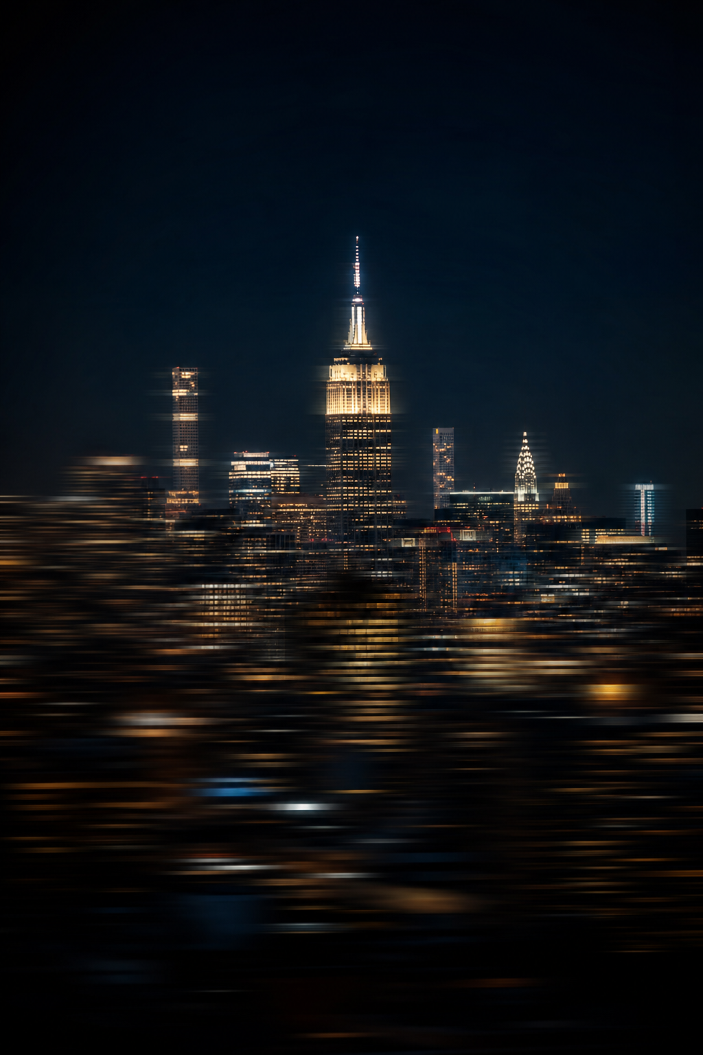 Motion-blurred New York City skyline at blue hour