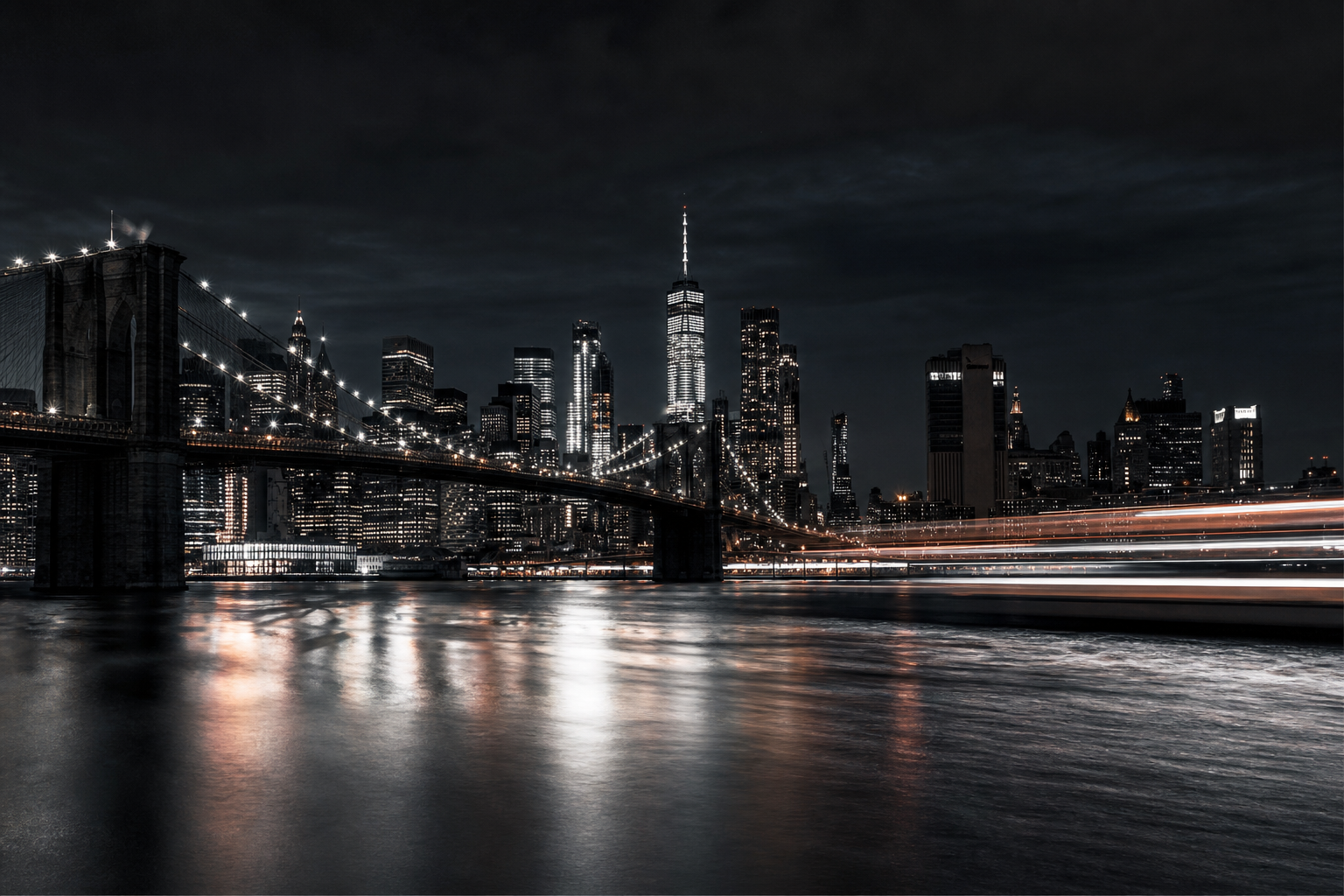 Motion-blurred NYC skyline and bridge lights at night